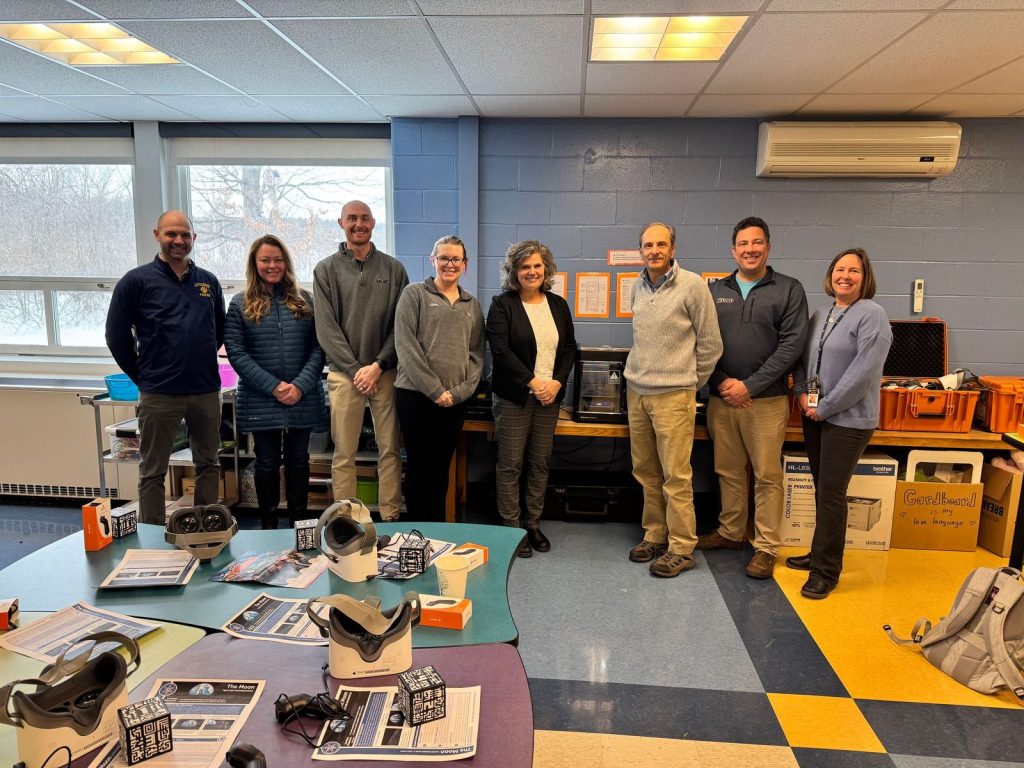 Photo of eight people involved in a community tech grant by LELWD