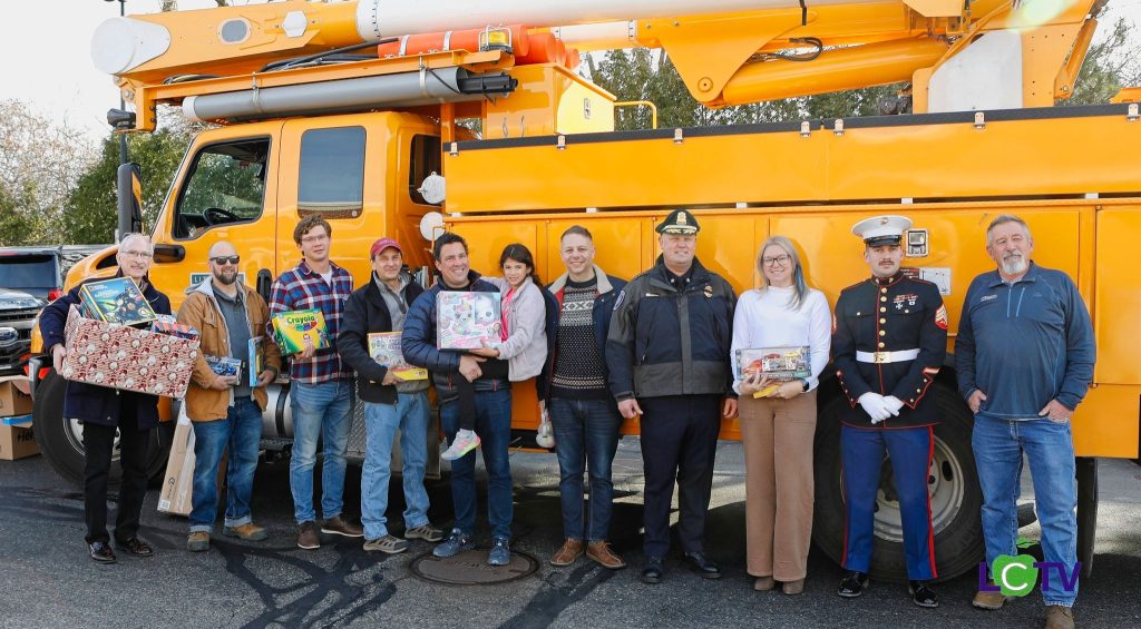 community advocates with gifts for a toy drive